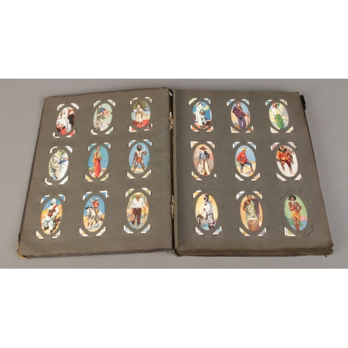 66 - A large quantity of cigarette cards with albums, including two complete albums, six empty albums and... 