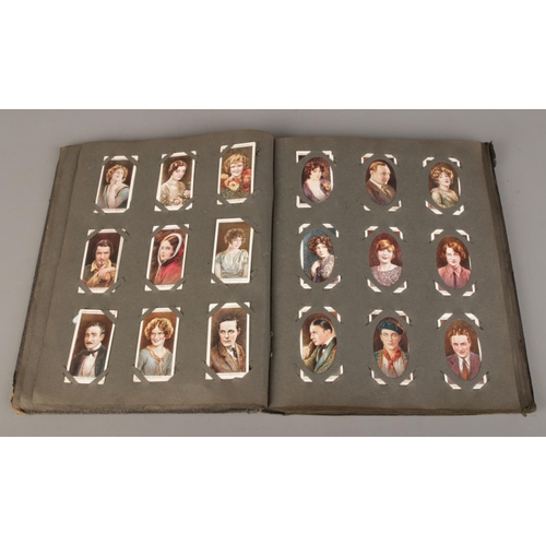 66 - A large quantity of cigarette cards with albums, including two complete albums, six empty albums and... 