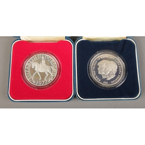 580 - The Royal Mint; two silver proof commemorative crowns. Minted for The Queen's silver jubilee and the... 