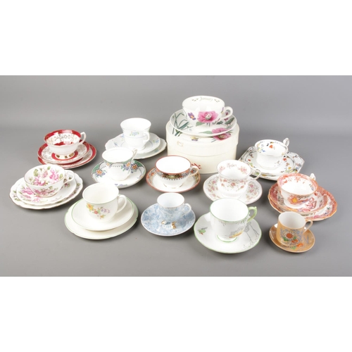 72 - A collection of bone china cups and saucers and trios. Includes Spode, Roslyn, Royal Grafton, Grindl... 