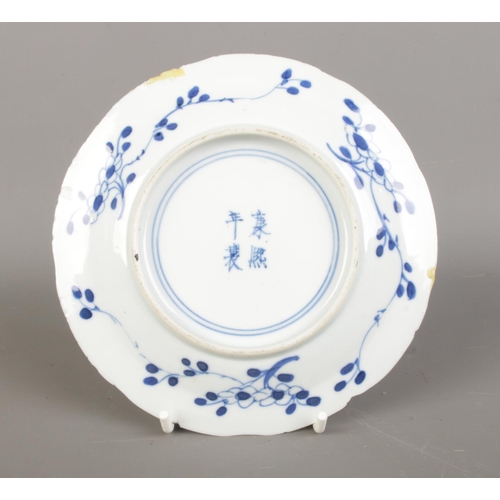 592 - A Chinese Qing Dynasty Kangxi (1662-1722) blue & white porcelain plate, feature branching blossoms a... 