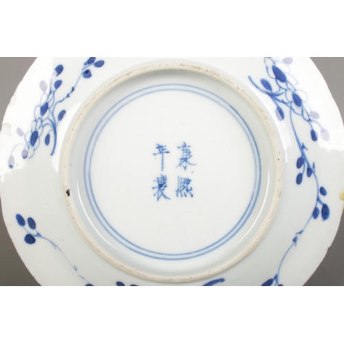 592 - A Chinese Qing Dynasty Kangxi (1662-1722) blue & white porcelain plate, feature branching blossoms a... 