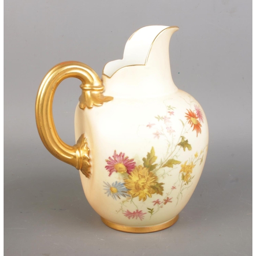 609 - A pair of Victorian Royal Worcester jugs, the bulbous bodies decorated with delicate flowers on a pe... 