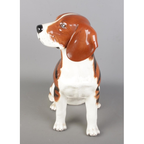 628 - A large vintage Beswick china model of a fireside Beagle dog, bears marks at base of 