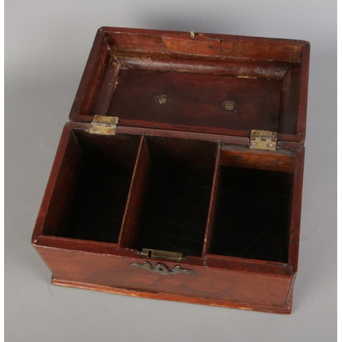 78 - A Victorian mahogany tea caddy featuring brass handle and escutcheon.