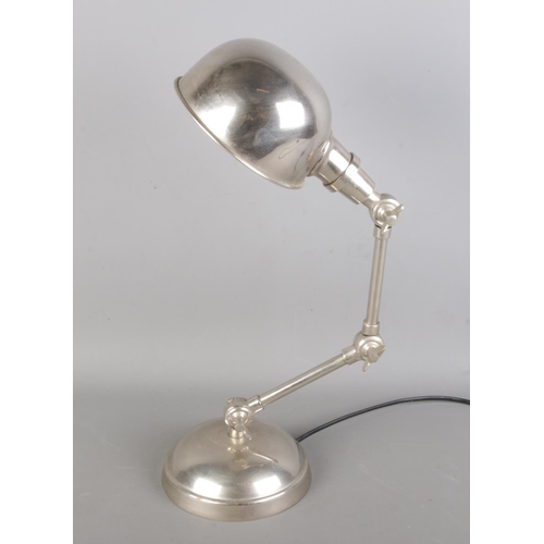 82 - A vintage table lamp in chrome, with dual articulated.