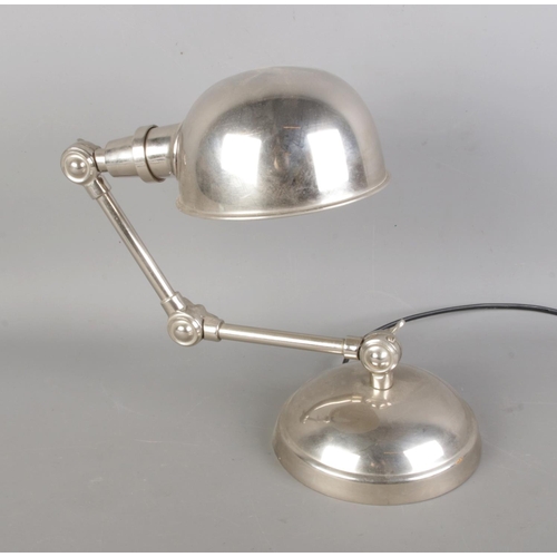 82 - A vintage table lamp in chrome, with dual articulated.