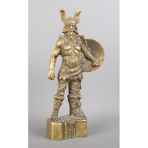 85 - A vintage brass sculpture of Viking warrior figure, 26cm tall.