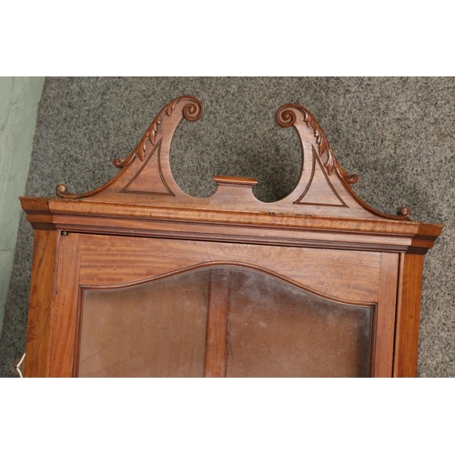 670 - A Georgian style satinwood hanging corner cabinet with twin swan neck pediment.