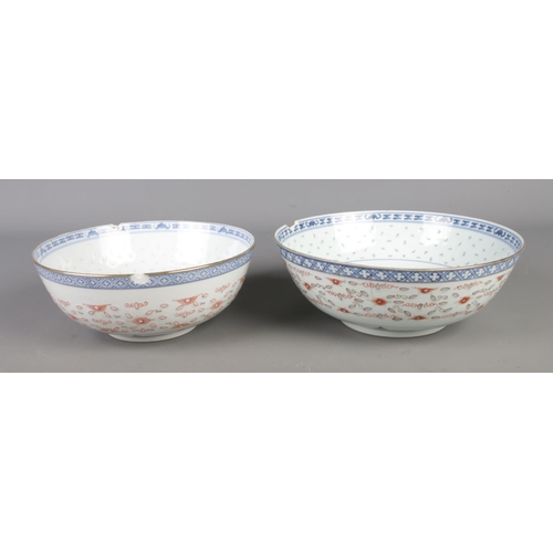 17 - Two Chinese blue and white rice grain pattern bowls both featuring central dragon motif in underglaz... 