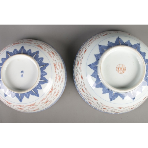 17 - Two Chinese blue and white rice grain pattern bowls both featuring central dragon motif in underglaz... 