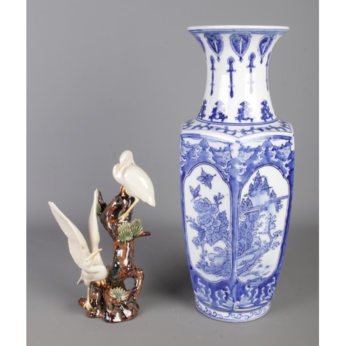 18 - Two pieces of oriental ceramics to include blue and white ceramic vase and a Stork figure group with... 