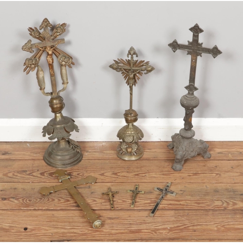 197 - A collection of metal and brassware depicting the religious crucifix of Jesus Christ.