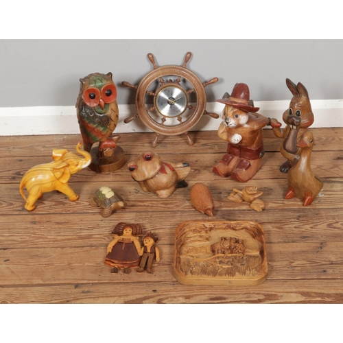 202 - A good collection of treen to include carved novelty animal figures and a Weathermaster barometer in... 