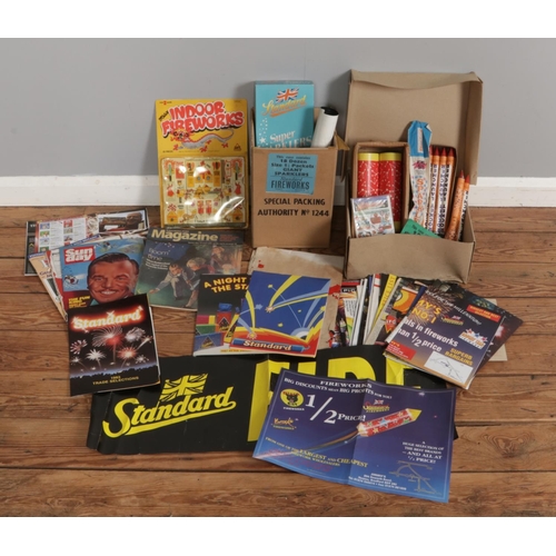 205 - A collection of assorted vintage firework items, including various Standard posters and magazines et... 