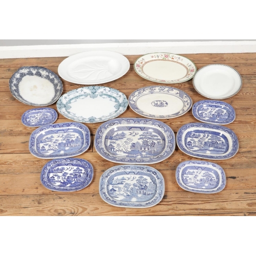 212 - A box of assorted large platters and dishes, including a set of blue and white willow pattern items,... 