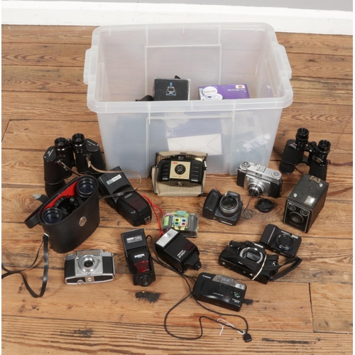 229 - A box of cameras, binoculars and camera accessories. Includes Agfa Ambi Silette, Canon AF-7, Ilford ... 