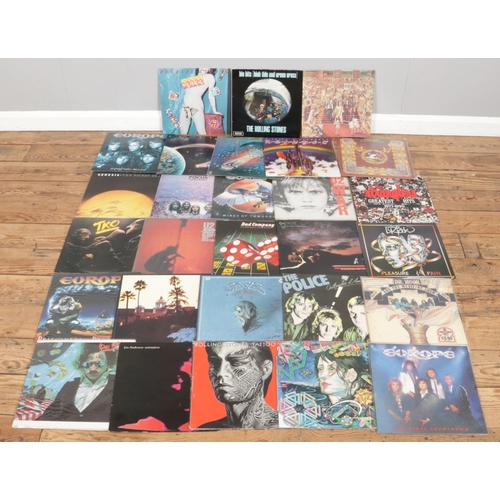 237 - A collection of LP records. Includes Eagles, Dr Hook, The Police, U2, Genesis, Europe, Rolling Stone... 