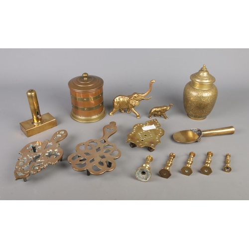 40 - A mixed collection of brassware, including cast brass elephant ornaments, decorative trivets, lidded... 