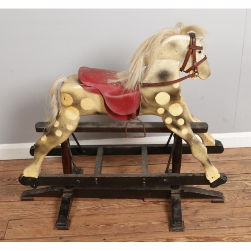 303 - An antique wooden rocking horse, made from solid wood with original paint and hair, measuring H85 x ... 