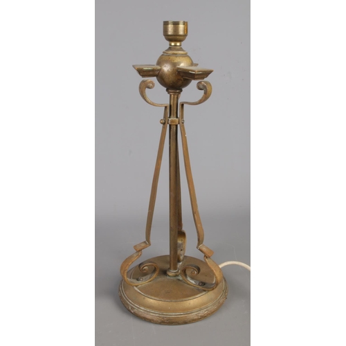 308 - Two vintage brass table lamps: one features a tripod-style with scroll arms in an Art Nouveau style,... 