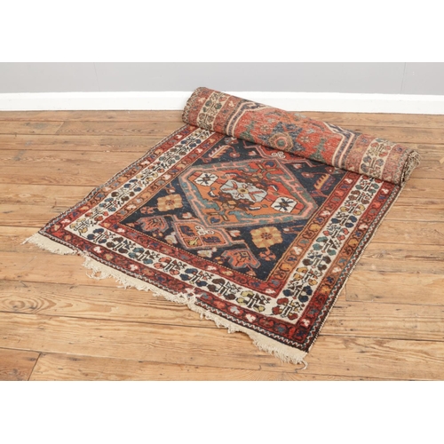 309 - A vintage Persian ground runner, size L307 x W113cm.