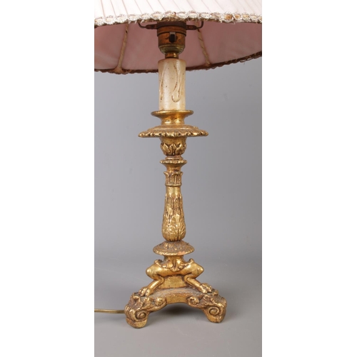 50 - A pair of vintage decorative table lamps, with gilt on wooden bodies, clawed feet and egg-shaped sha... 