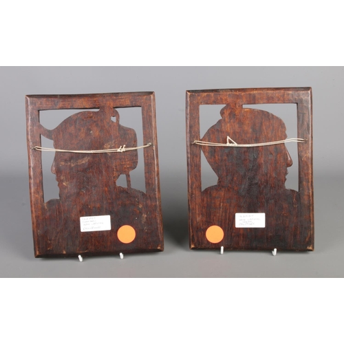 357 - A pair of traditional Philippine hand-carved solid wooden hanging wall plaques depicting Igorot peop... 