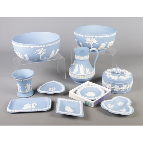 54 - A quantity of Wedgwood blue jasperware. Includes bowls, pin dishes, jug etc.