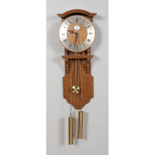 377 - A Dutch Tempus Fugit oak wall clock featuring German Franz Hermle 241-030 chiming movement.