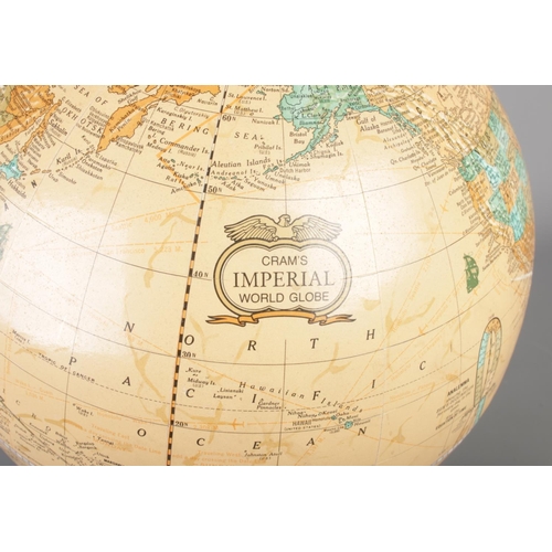 69 - A George F Cram Imperial World Globe on marble stand. Height 42cm.