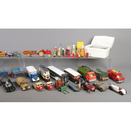 224 - A box of assorted die-cast vehicles and accessories. To include Corgi, Dinky Toys, Budgie Toys, Lesn... 