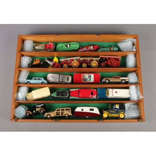 31 - A wooden display case containing a quantity of die-cast vehicles. To include Corgi BRM Formula 1 car... 