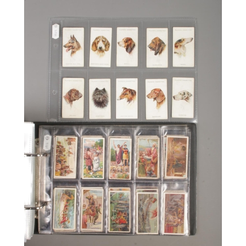 42 - A folder containing a large collection of cigarette and tea cards, in 14 complete sets. 
John Player... 