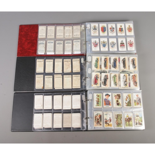 49 - Three albums of part sets of Cigarette and collectors cards, containing Motor Cars, Engineering Wond... 