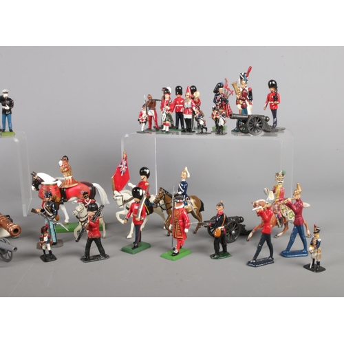 55 - A large collection of painted lead soldiers, containing several Britain examples. Includes drummers ... 