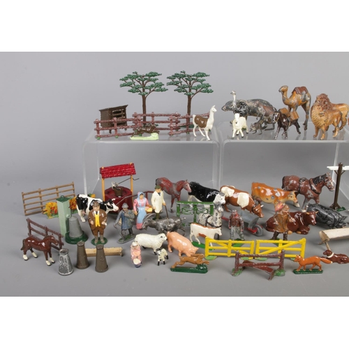 59 - A collection of lead farm and wild animals, with accessories. Includes several Britain examples, wit... 