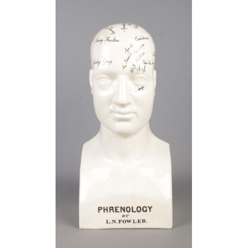 6 - A large Staffordshire L.N Fowler Phrenology head, with extract to the back and notes for the functio... 