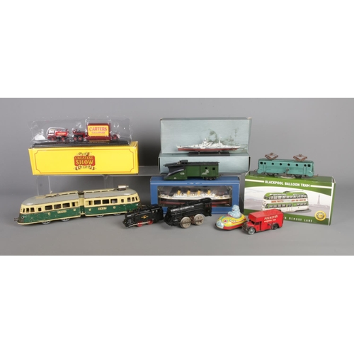 63 - A quantity of assorted model vehicles, to include French SNCF tin plate clockwork tram, Atlas Trams ... 