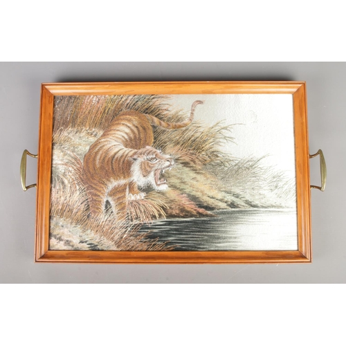 65 - A mid Twentieth century twin handled serving tray housing a silk panel of a hunting tiger. Length: 5... 