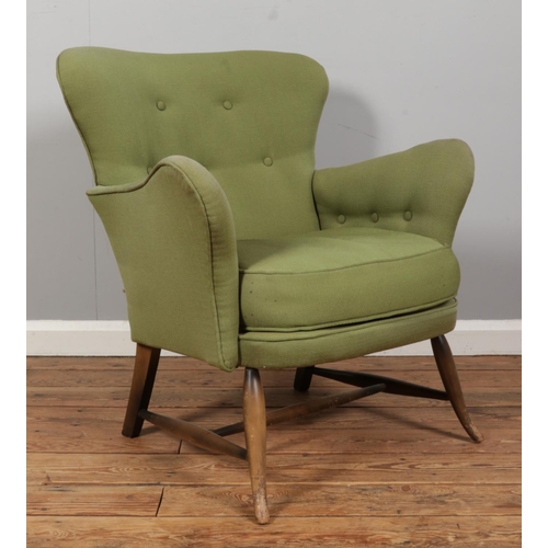 549 - An Ercol tub armchair, model 236, with button back and sides. Upholstered in olive green.