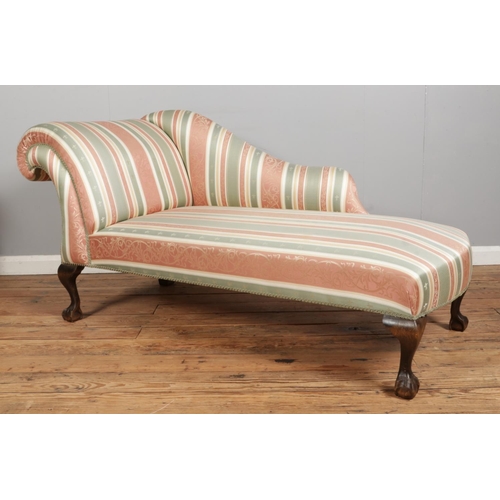 550 - A Twentieth Century chaise lounge, in striped fabric upholstery raised on mahogany ball and claw fee... 