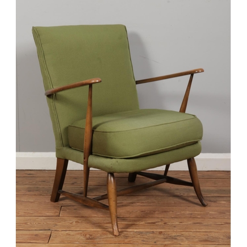 552 - A vintage Ercol armchair, Model 248, upholstered in light green fabric to the cushioned back rest an... 