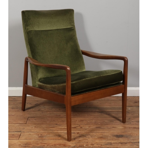 553 - A mid-century Cintique style armchair, upholstered in dark green.