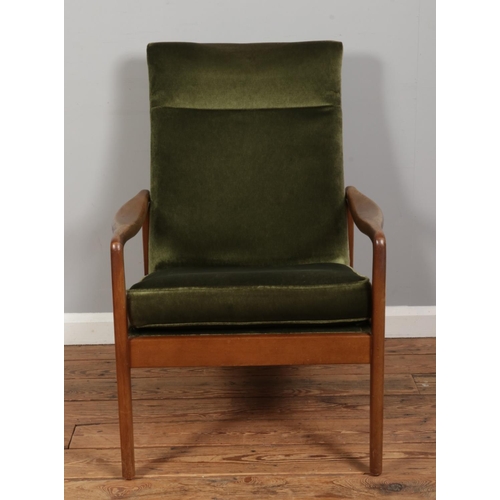 553 - A mid-century Cintique style armchair, upholstered in dark green.