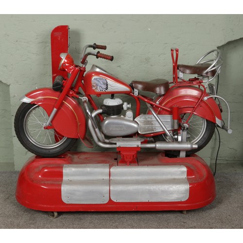 A 1950's/60's Lenaerts free-standing 'Indian Chief' motorbike carousel ride. Produced between 1955-1966 as a fairground ride, the bike was later turned into an arcade ride by 'Edwin Hall Company' of Streatham. Mains operated and on wheels.