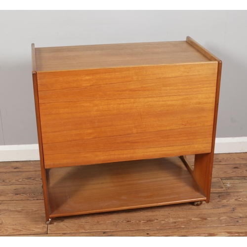 385 - A mid-century teak drinks trolley with folding top, made by AH McIntosh of Kirkcaldy Scotland, size ... 