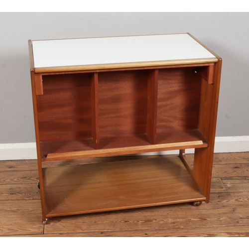 385 - A mid-century teak drinks trolley with folding top, made by AH McIntosh of Kirkcaldy Scotland, size ... 