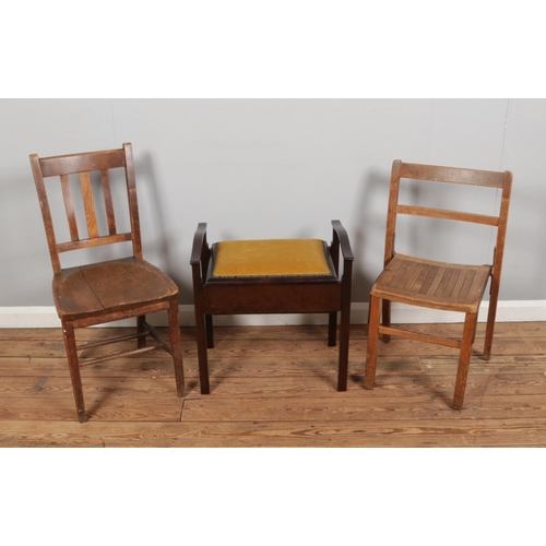 387 - Two antique solid wood chairs, along with a vintage piano stool featuring yellow upholstery.