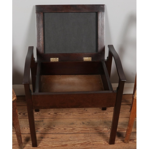 387 - Two antique solid wood chairs, along with a vintage piano stool featuring yellow upholstery.